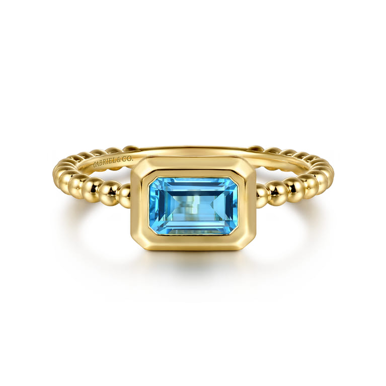 Promise Ring - 14K Yellow Gold Emerald Cut Blue Topaz Bujukan Promise Ring - Shot 1