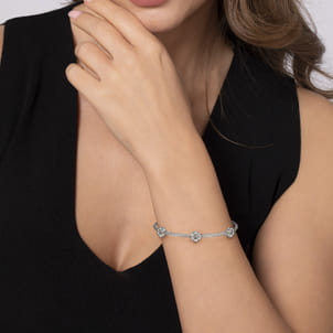 Sterling Silver-Stainless Steel Twisted Cable Bangle with 3 Flower Cluster Diamond Stations