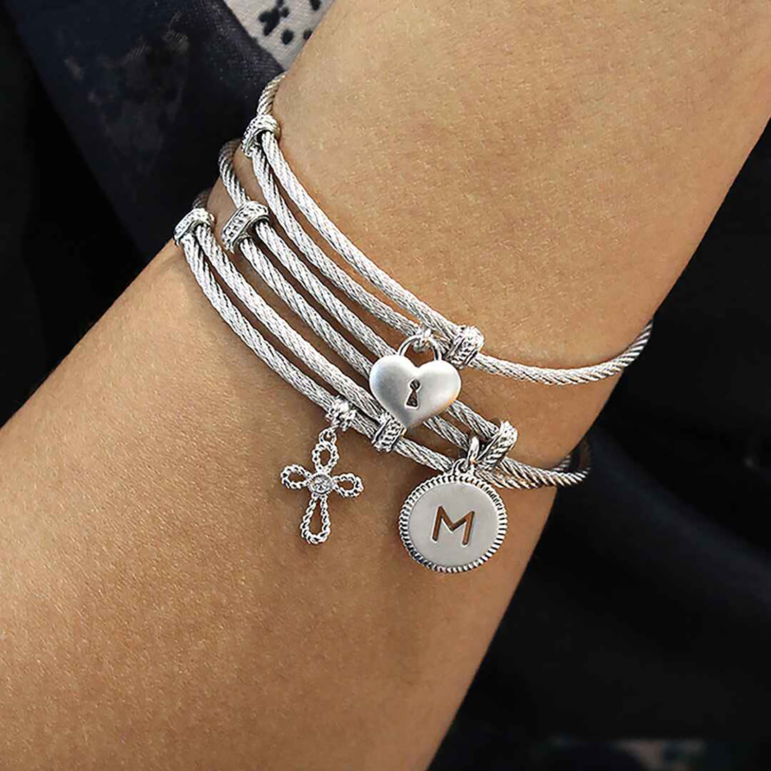 Adjustable Twisted Cable Stainless Steel Bangle with and White Sapphire Cross Charm in Sterling Silver, photograph 3