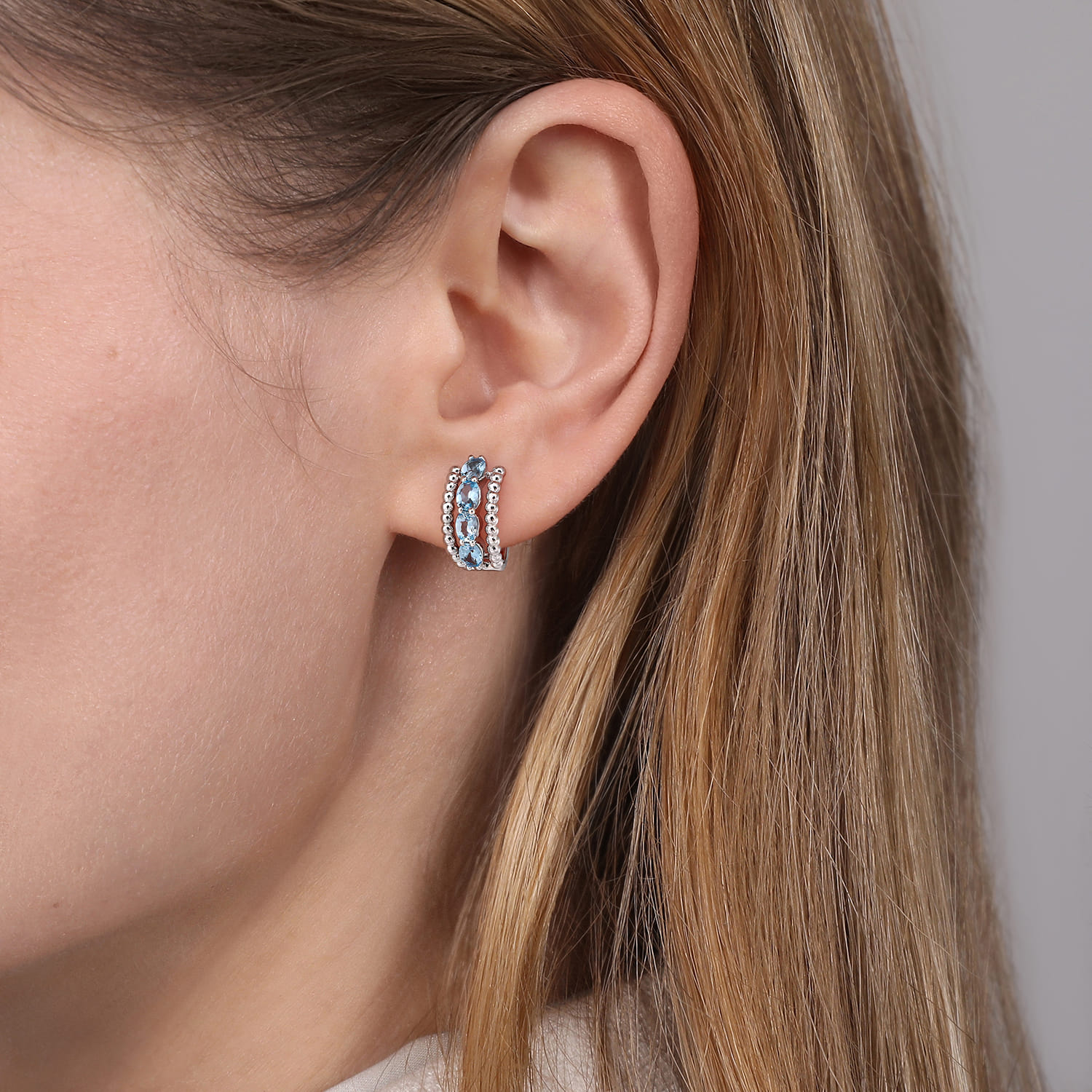 Bujukan Swiss Blue Topaz Huggie Earrings in Sterling Silver, photograph 2