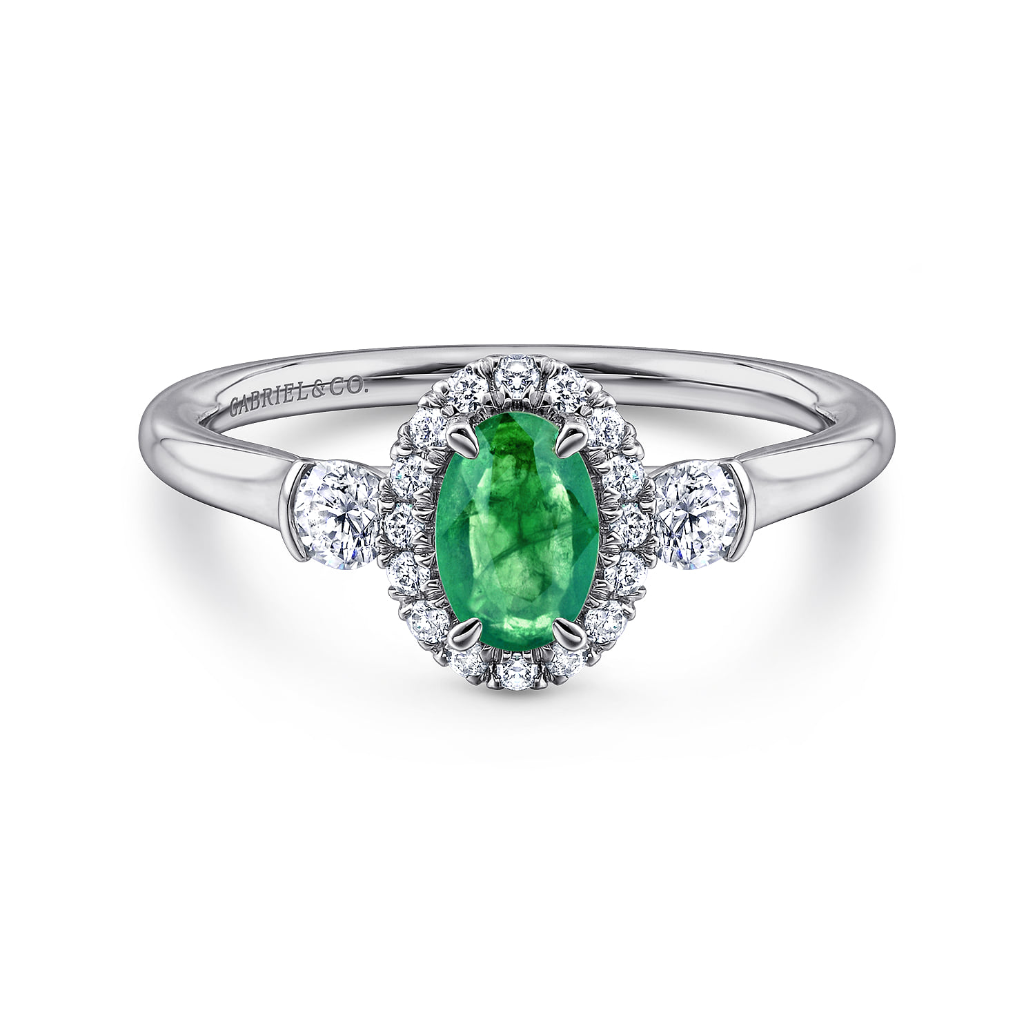 Oval Emerald and Diamond Halo Three Stone Ring