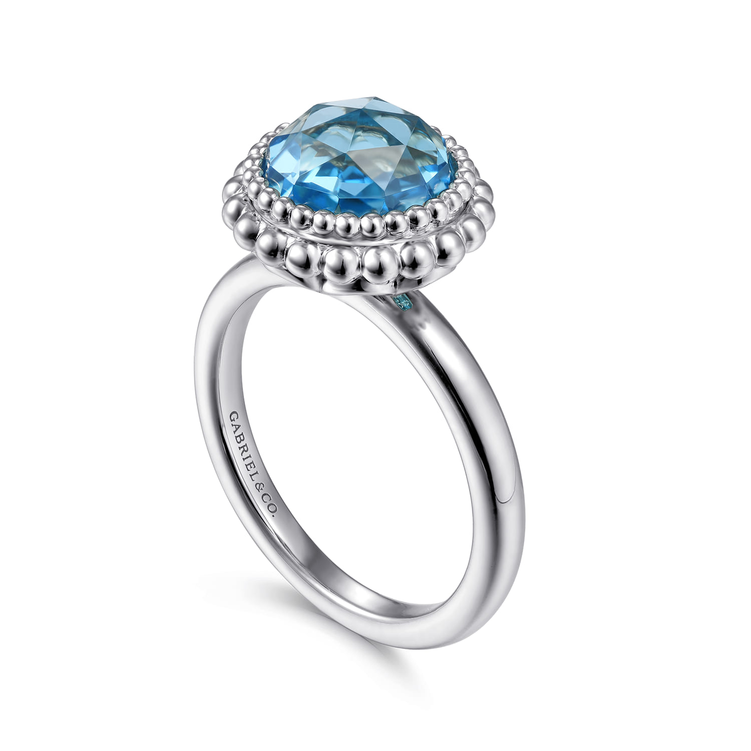 Round Blue Topaz Bezel Set Ring with Bujukan Bead Halo in Sterling Silver, photograph 3