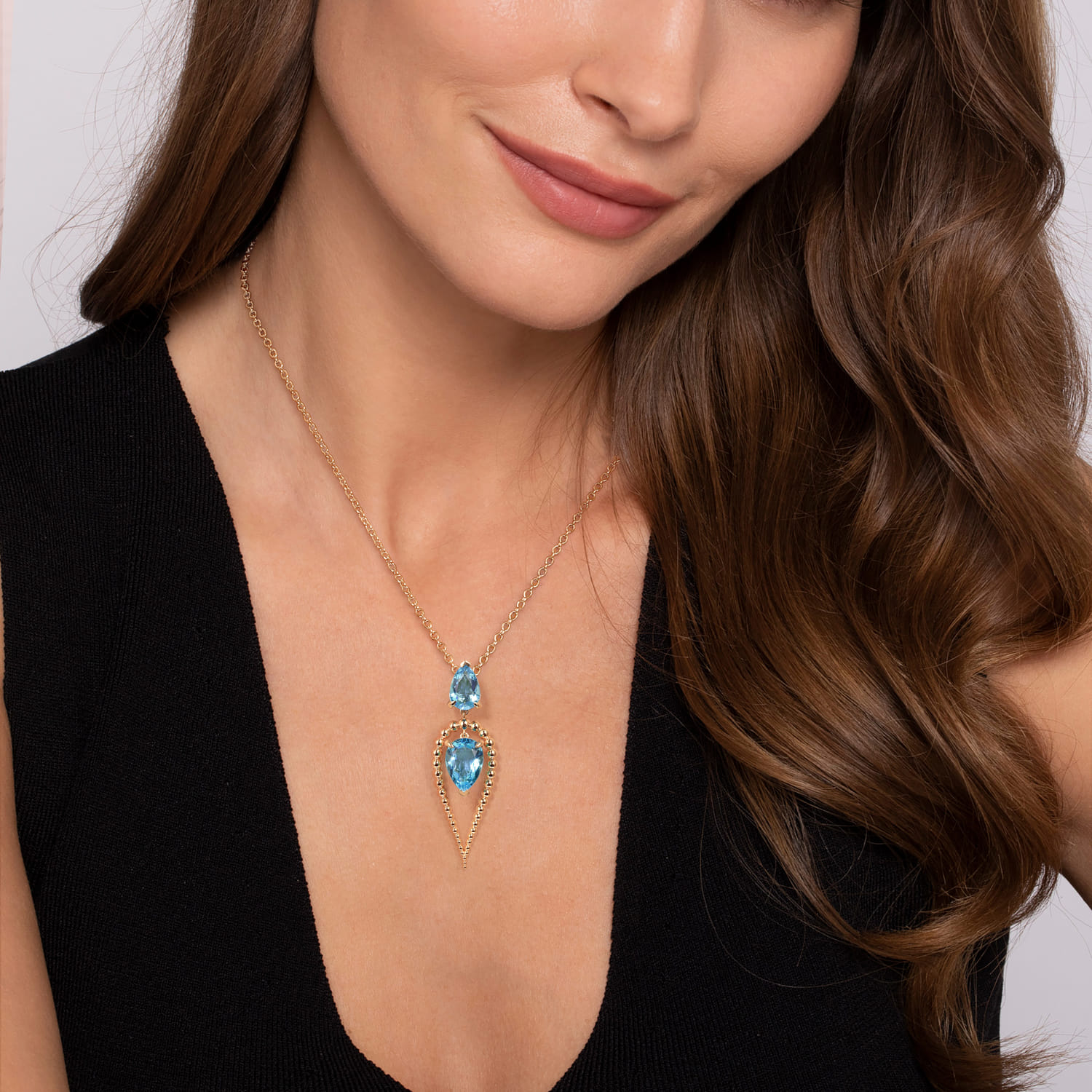 Bujukan and Blue Topaz Pear Shape Pendant Drop Necklace in 14K Yellow Gold, photograph 3