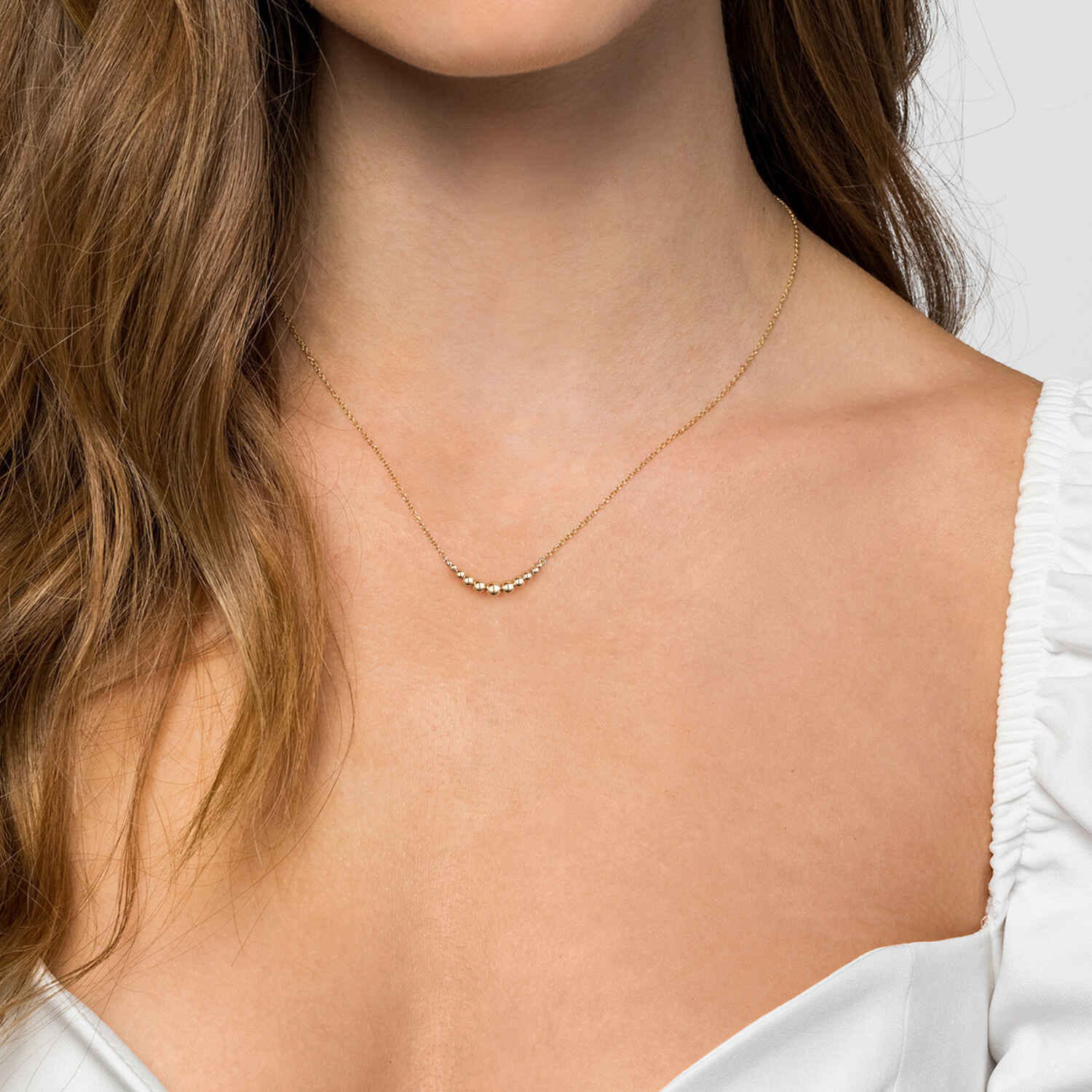 Graduating Bujukan Ball Bar Necklace in 14K Yellow Gold, photograph 3