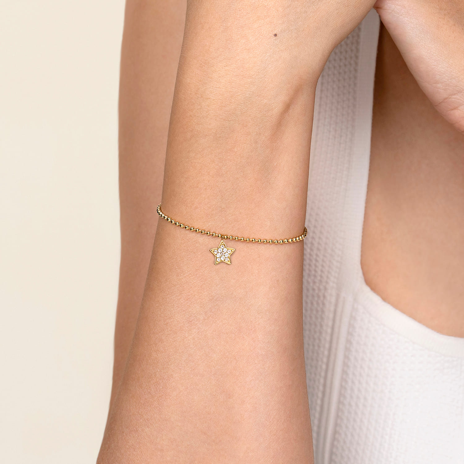Bujukan and White Sapphire Star Charm Bracelet in 14K Yellow Gold, photograph 3