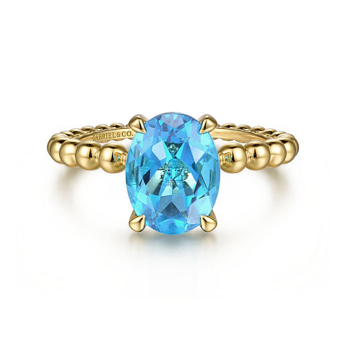 14K Yellow Gold Bujukan Oval Swiss Blue Topaz Bujukan Ring