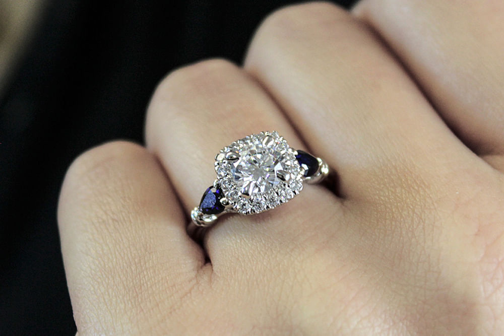 18K White Gold Cushion Three Stone Halo Round Sapphire and Diamond Engagement Ring angle 